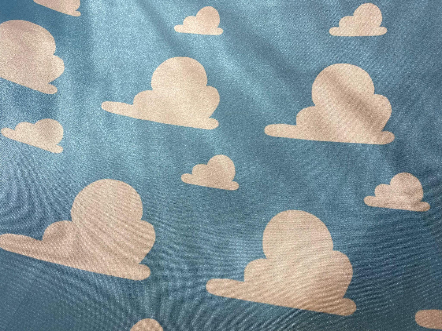 Toy Story Cloud Print Toss on Satin Fabric – 100% Polyester, 58″ Wide | Gtex Fabrics
