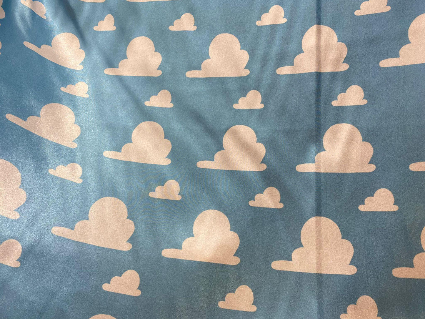 Toy Story Cloud Print Toss on Satin Fabric – 100% Polyester, 58″ Wide | Gtex Fabrics