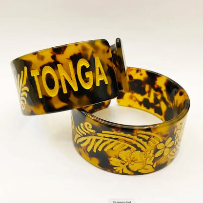 Tonga Bracelet, Bangle, Jewelry, Acrylic Resin Tortoise Shell Material With Hibiscus Flowers, Engraved Letters, Polynesian Design | Gtex Fabrics