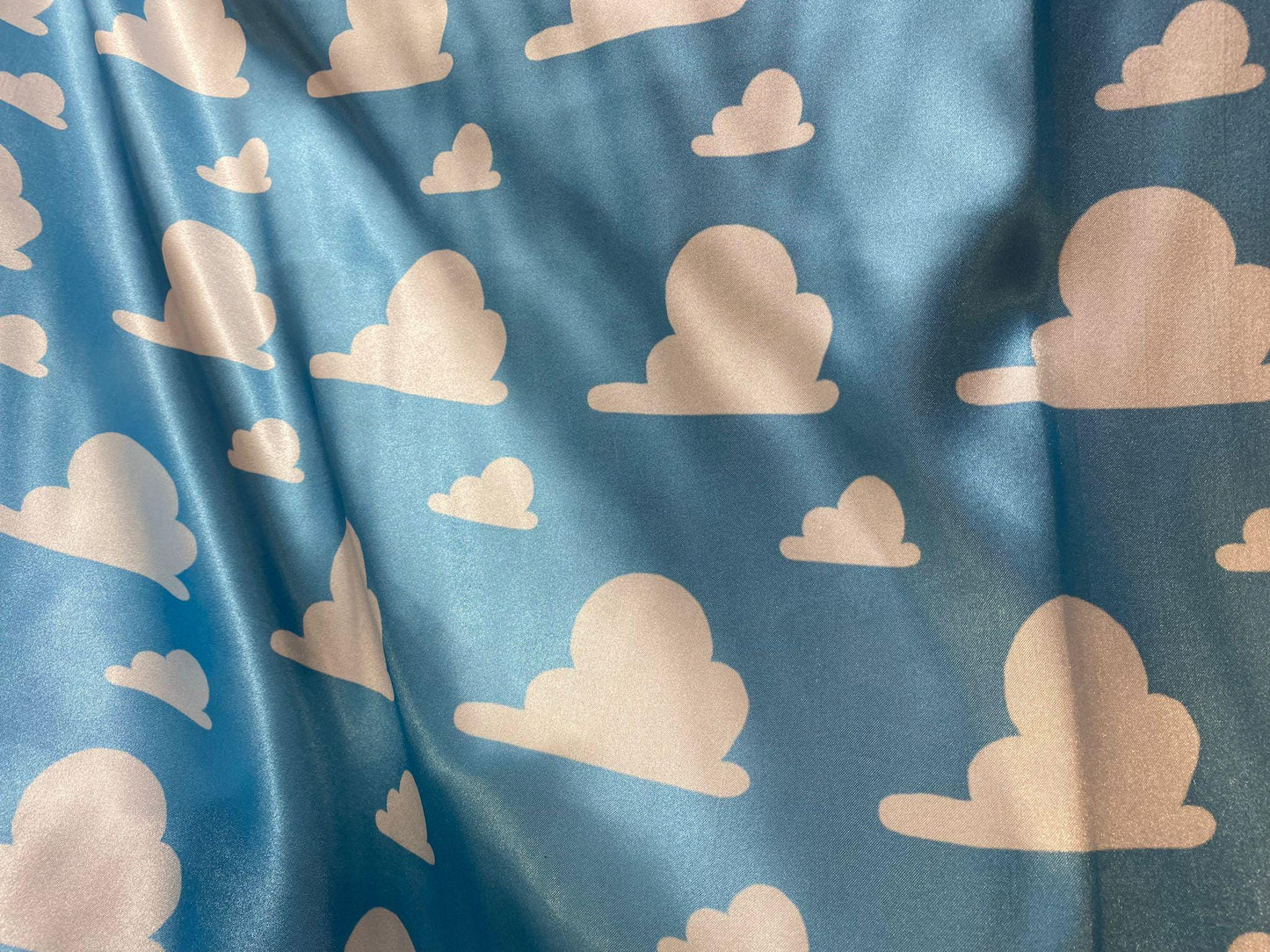 Toy Story Cloud Print Toss on Satin Fabric – 100% Polyester, 58″ Wide | Gtex Fabrics