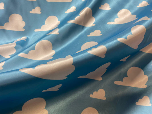 Toy Story Cloud Print Toss on Satin Fabric – 100% Polyester, 58″ Wide | Gtex Fabrics